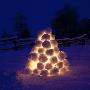 Pyramid Made Of Snowballs Lit Up At Night by Ove Eriksson Limited Edition Print