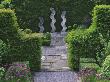 Path With Chives And Yew Hedge To Sculpture By Helen Sinclair, Designer: Tony Ridler by Clive Nichols Limited Edition Print