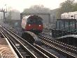 Piccadilly Line Train Approaching Turnham Green Underground Station, London by Natalie Tepper Limited Edition Print