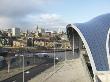 The Sage Gateshead, Gateshead, Tyne And Wear, England, Canopy Over Main Entrance With City In Back by Richard Bryant Limited Edition Pricing Art Print