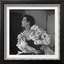 Model Wearing A Flowery Dress While Peering Into The Distance by Nina Leen Limited Edition Pricing Art Print