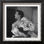 Model Wearing A Flowery Dress While Peering Into The Distance by Nina Leen Limited Edition Print