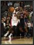 Atlanta Hawks V Toronto Raptors: Julian Wright And Jordan Crawford by Ron Turenne Limited Edition Print