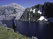 A Climber Enjoying The View Over A Mountain Lake, Chile by Pablo Sandor Limited Edition Print