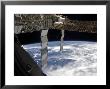 International Space Station Backdropped Againts A Blue And White Earth by Stocktrek Images Limited Edition Pricing Art Print