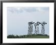 Cluster Of Windmills Rises Over The Rolling Countryside by Tom Murphy Limited Edition Pricing Art Print