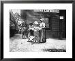 Two Young Black Women Selling Cakes At Alston Railroad Station, Next To A Train That Has Stopped by Wallace G. Levison Limited Edition Print