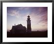 Golden Sunset At Nantucket, Mass. With Sankaty Head Lighthouse Silhouetted Against Sky by Andreas Feininger Limited Edition Print