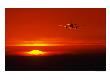 Airplane In Flight In View Of The Setting Sun by Peter Walton Limited Edition Print