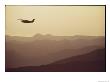 An Aircraft Flies Over A Mountainous Landscape by Joel Sartore Limited Edition Print