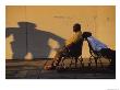 Two Men Relax On City Benches In Downtown New Orleans by Joel Sartore Limited Edition Print