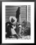 Haitian Native Engaged In A Siesta Next To Giant American Toothbrush Ad He Totes Around The Streets by Rex Hardy Jr. Limited Edition Pricing Art Print