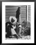 Haitian Native Engaged In A Siesta Next To Giant American Toothbrush Ad He Totes Around The Streets by Rex Hardy Jr. Limited Edition Pricing Art Print