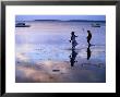 Children Standing In Shallow Tide, Tongatapu Island, Tongatapu Group, Tonga by Peter Hendrie Limited Edition Print