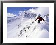 Downhill Skier Launching Off A Cornice In Front Of Lone Mountain by Gordon Wiltsie Limited Edition Print