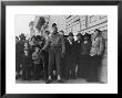 Soldier Standing Guard In Front Of Japanese American Citizens Awaiting Transport To Relocation Camp by Dorothea Lange Limited Edition Print