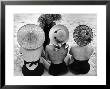 Models On Beach Wearing Different Designs Of Straw Hats by Nina Leen Limited Edition Pricing Art Print