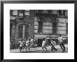 Young Boys With Sticks, Running Around While Playing A Street Game In Spanish Harlem by Ralph Morse Limited Edition Print