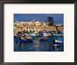 Luzzus, Traditional Fishing Boats Moored In Harbour, Marsaxlokk, Malta by Pershouse Craig Limited Edition Print