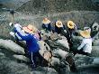 Women Working On Dinosaur Site With Bones Dating Back 140 Million Years, Kanchanaburi, Thailand by Bill Wassman Limited Edition Print