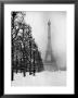 Heavy Snow Blankets The Ground Near The Eiffel Tower by Dmitri Kessel Limited Edition Pricing Art Print