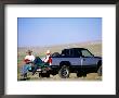 Cowboy Musicians On Back Of Pick-Up Truck, Near South Pass, Wyoming by Holger Leue Limited Edition Print