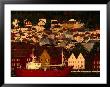 Fishing Vessel Moored In Front Of Wooden Buildings On The Bryggen Waterfront, Bergen, Norway by Anders Blomqvist Limited Edition Print