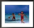 Children Running Out Of Ocean In Stormy Weather, Seychelles by Philip & Karen Smith Limited Edition Print