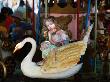 Girl On A Carousel At The Flea-Market Festival, Vence, France by Robert Eighmie Limited Edition Print