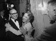 Actor Jack Benny Hugging Actress Helen Hayes At The Opening Of The New Huntington Hartford Theater by Loomis Dean Limited Edition Print
