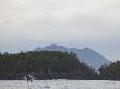 Whale Breaches Near The Mountainous Coastline Of Vancouver Island by Taylor S. Kennedy Limited Edition Print