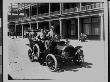 Group Of Men Sitting In Government Automobile, In Front Of Adams Hotel by W.J. Lubken Limited Edition Print