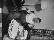 Writer Damon Runyon Sitting At His Desk Piled With Papers by Gjon Mili Limited Edition Print
