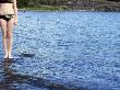 Low Section View Of A Woman On Rocks, Erstavik, Sweden by Inger Bladh Limited Edition Print