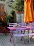 Pink Wooden Table And Orange Parasol by Clive Nichols Limited Edition Print