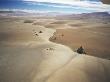 Barren Landscape And A Solitary Dirt Road Through The Altiplano At 4500M, Bolivia, South America by Doug Allan Limited Edition Print