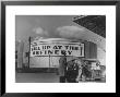 Gas Station Attendant Changing Oil For A Customer Next To Fill Up At The Refinery Sign by Margaret Bourke-White Limited Edition Print