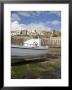 White Boat On The Landing In Harbour At Low Tide With Old Bay Area Of Fishing Village by Pearl Bucknall Limited Edition Print