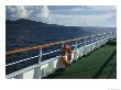 Deck Of A Cruise Ship In The South Pacific Ocean With A Volcanic Island In The Background by Todd Gipstein Limited Edition Print