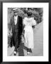 African American Sporting His Sunday Finery Glancing At Frilly Frocked Girl Passing Him On Street by Alfred Eisenstaedt Limited Edition Print