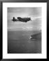 F-6 Hellcat Fighter Plane Over Tanahmera Bay As Japanese Airfields At Hollandia, New Guinea by J. R. Eyerman Limited Edition Print