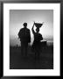 Farm Couple Returning From A Day's Work As Woman Carries Turkey Chicks In Bucket Balanced On Head by Alfred Eisenstaedt Limited Edition Pricing Art Print