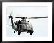 Hh-60 Pave Hawk Helicopter Conducts Search And Rescue Operations by Stocktrek Images Limited Edition Print