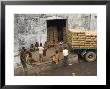 Warehouse Workers Having Rest Break At Carrit Moran & Company's Tea Warehouses At Kolkata Port by Eitan Simanor Limited Edition Print