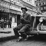 Baseball Player Satchel Paige, Looking Dapper, Lighting His Cigarette Outside Poolroom In Harlem by George Strock Limited Edition Pricing Art Print