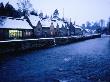 Buildings In Cotswolds Village On Winter Night, Bibury, Gloucestershire, England by Jon Davison Limited Edition Print