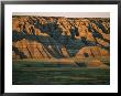 Sunset On The Eroded Land Formations Of The Badlands by Annie Griffiths Belt Limited Edition Pricing Art Print