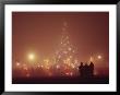The National Christmas Tree And Visitors On A Foggy Night by Karen Kasmauski Limited Edition Print