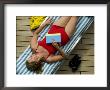 Close View Of Woman Sleeping On The Deck Of A Cruise Ship by Todd Gipstein Limited Edition Pricing Art Print