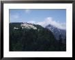 Castle In Pine Covered Mountains Near Salzburg, Austria by Ian Griffiths Limited Edition Pricing Art Print